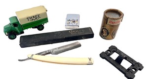 lot 257 image: Group of Vintage Collectibles Toy Truck, Straight Razor, Tin, and More