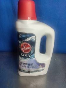 lot 23 image: Hoover Oxy Carpet Cleaning Solution, a formula designed for permanent stain removal and odor neutralization.