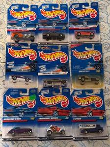 lot 140P image: 9 Hot Wheels Diecast Cars in Packaged Assortment (Quicksilver, Enforcer, Tipper Series)