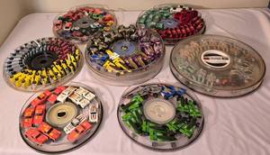 lot 49K image: LR - Collection of Hot Wheels Cars in 7 Round Containers Including McDonalds, Quaker State, Firebird and More