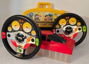 lot 69K image: LR - Sesame Street and Race Car Die-Cast Vehicle Carrying Cases with 2 Hot Wheels Steering Wheel Toys