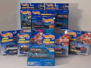 lot 76K image: LR - Collection of 8 Hot Wheels Long Haulers and Racing Hauler Packs