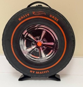 lot 199 image: Hot Wheels 12 Car Rally Case by Mattel in Vintage Tire Design