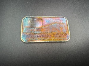lot 41 image: Beautiful Rainbow Toned 1 Oz. Silver USS Arizona Pearl Harbor Silver Round
