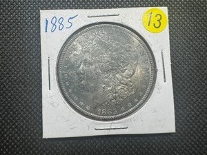 lot 13 image: 1885 Morgan Silver Dollar  Higher Grade, Toned