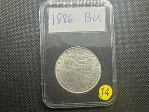 lot 14 image: 1886 Morgan Silver Dollar Marked BU When Purchased