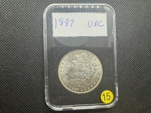 lot 15 image: 1887 Morgan Silver Dollar Marked UNC When Purchased