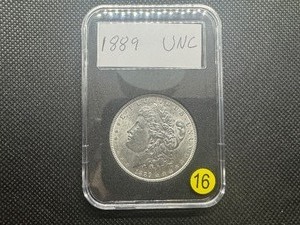 lot 16 image: 1889 Morgan Silver Dollar Marked UNC When Purchased