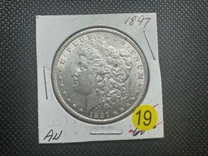lot 19 image: 1897 Morgan Silver Dollar Marked AU When Purchased
