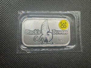 lot 38 image: 2023 BU Stacks & Bowers 1 Oz. Silver Bar