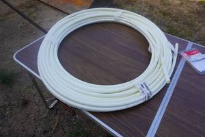 lot 16 image: Partial Roll of Pex 12 Water Line