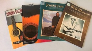 lot 239 image: Lot of Four Guitar Music Books inc. Johnny Cash, Hank Williams