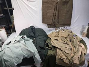 lot 73 image: Large Lot of Military Uniform Collection including Various Jackets, Pants, and Shirts Mostly Army