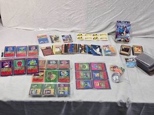 lot 79 image: Mixed trading card collection featuring Yu-Gi-Oh, Pokmon, Pukemon, Mega Man, and The Tick cards
