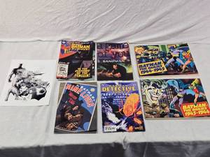 lot 84 image: Lot of Assorted Batman and Sandman Comic Books including Batman The Dailies 1944-1945, Batman The Dailies 1943-1944,Batman Nine Lives and Batman Detective Comics