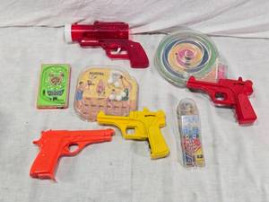 lot 105 image: Vintage Toy Collection including Pachinko Game, Plastic Guns, and Ball Games