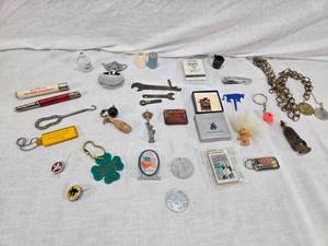 lot 150 image: Assorted Vintage and Novelty Collectibles including 471st Bombardment Squadron Pin, Jostens Medal,  Miniature Comics and More