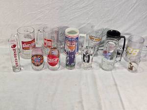 lot 209 image: Collectible Glassware Including Slim Jim Racing Team Mugs, Nebraska Shot Glass, NCAA Final Four Glass, Super Bowl XXI mug and a Jim Beam Stakes glass and More