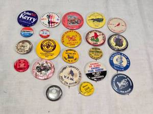 lot 218 image: Vintage and Commemorative Pinback Buttons including John Kerry for President and Hubert Humphrey, as well as buttons from various events like the LA 1984 Olympics and local festivals