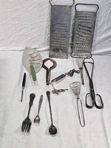lot 236 image: Vintage Kitchen Utensils Lot including Miracle Can Opener, Graters, and Silverware