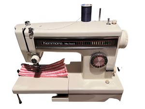 lot 81 image: Kenmore Ultra Stitch 12 Sewing Machine with Wood Cabinet