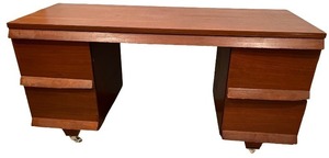 lot 101 image: Vintage Wooden Desk with Six Drawers and Casters
