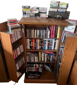 lot 136 image: Multimedia Collection with Wooden Storage Cabinet - CDs, DVDs, VHS Tapes, and Cassette Tapes