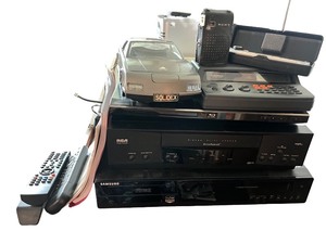 lot 146 image: Electronics Lot RCA and Samsung Players, Radios, Remote Controls, SOLIDEX Model Car