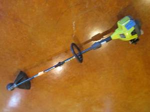 lot 29 image: Ryobi 2-cycle gas powered weed whip...