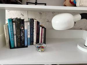 lot 132 image: Collection of 11 Hardcover and Paperback Books with Modern White Desk Lamp