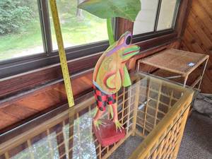 lot 92 image: Hand-Painted Wooden Frog Statue with Sunglasses and Leaf