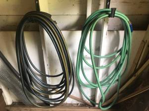 lot 188 image: Set of 2 Garden Hoses Black and Green