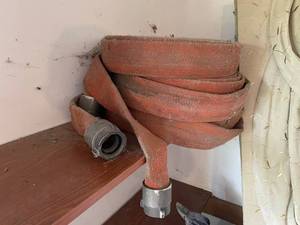 lot 216 image: Red Head NH Industrial Fire Hose with Metal Couplings