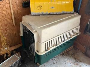 lot 225 image: Remington Large Plastic Pet Crate with Metal Door