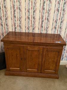 lot 147 image: Solid Wood Cabinet with Flip-Top Panels and Interior Shelving