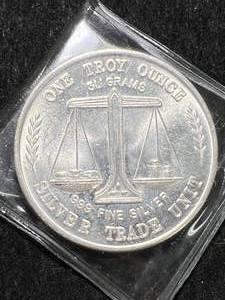 lot 38 image: 1 TROY OZ .999 FINE SILVER TRADE UNIT ROUND