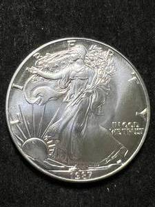 lot 45 image: 1987 AMERICAN SILVER EAGLE 1 TROY OZ .999 FINE SILVER