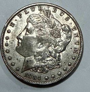 lot 54 image: 1884-O Morgan Silver Dollar
