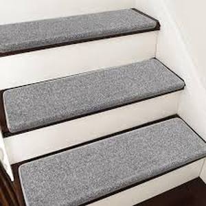 lot 37 image: PURE ERA Light Grey 9.5 in. x 30 in. x 1.2 in. Polypropylene Bullnose Tape Free Non-slip Stair Tread Cover Carpet Mats Set of 14  Customer Returns See Pictures