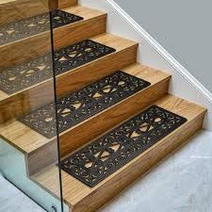 lot 55 image: Lot of Ottomanson Outdoor Collection Rubberback Black Iron Cutout 10 in. x 30 in. ., Stair Tread Covers (Set of 5)   Customer Returns See Pictures