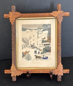 lot 28 image: Church Christmas Tree Print by Grandma Moses in Antique Frame