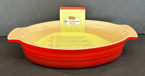 lot 11 image: Le Creuset Stoneware Casserole Dish  Oval Baker
