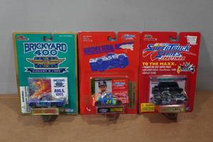 lot 191 image: 3 Racing Champions Super Truck Die CastsCollectors Cards with Stand