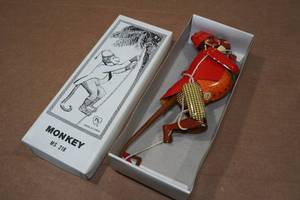 lot 245 image: Vintage Look Tin Litho Climbing Monkey