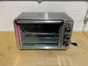 lot 142 image: Spectrum Brands TO3215SS Black & Decker Crisp N Bake Convection Air Fry Countertop Oven