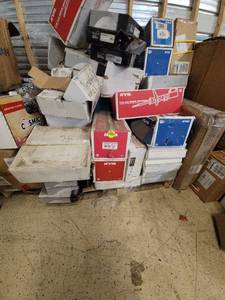 lot 21 image: Car part pallet including gas shock absorbers, brake drums, rotors and struts galore