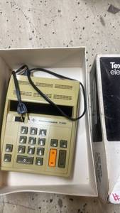 lot 102 image: Texas Instruments TI-3000 Electronic Calculator with Dust Cover and Original Box