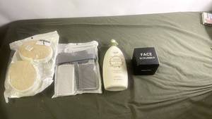 lot 235 image: Personal Care Lot with Loofah Pads, Face Scrubber, Comb Set, and Baby Lotion