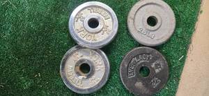 lot 11 image: Four 2.5 LB One inch Weight Plates (USED)