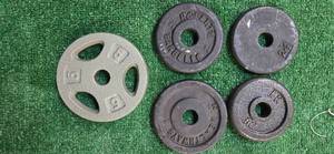 lot 37 image: Lot of four 2.5LB  and one 5LB one-inch Weight Plates (USED)